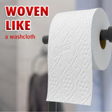 Roll of paper towel with woven texture, labeled 'WOVEN LIKE a washcloth', on a blurred background.
