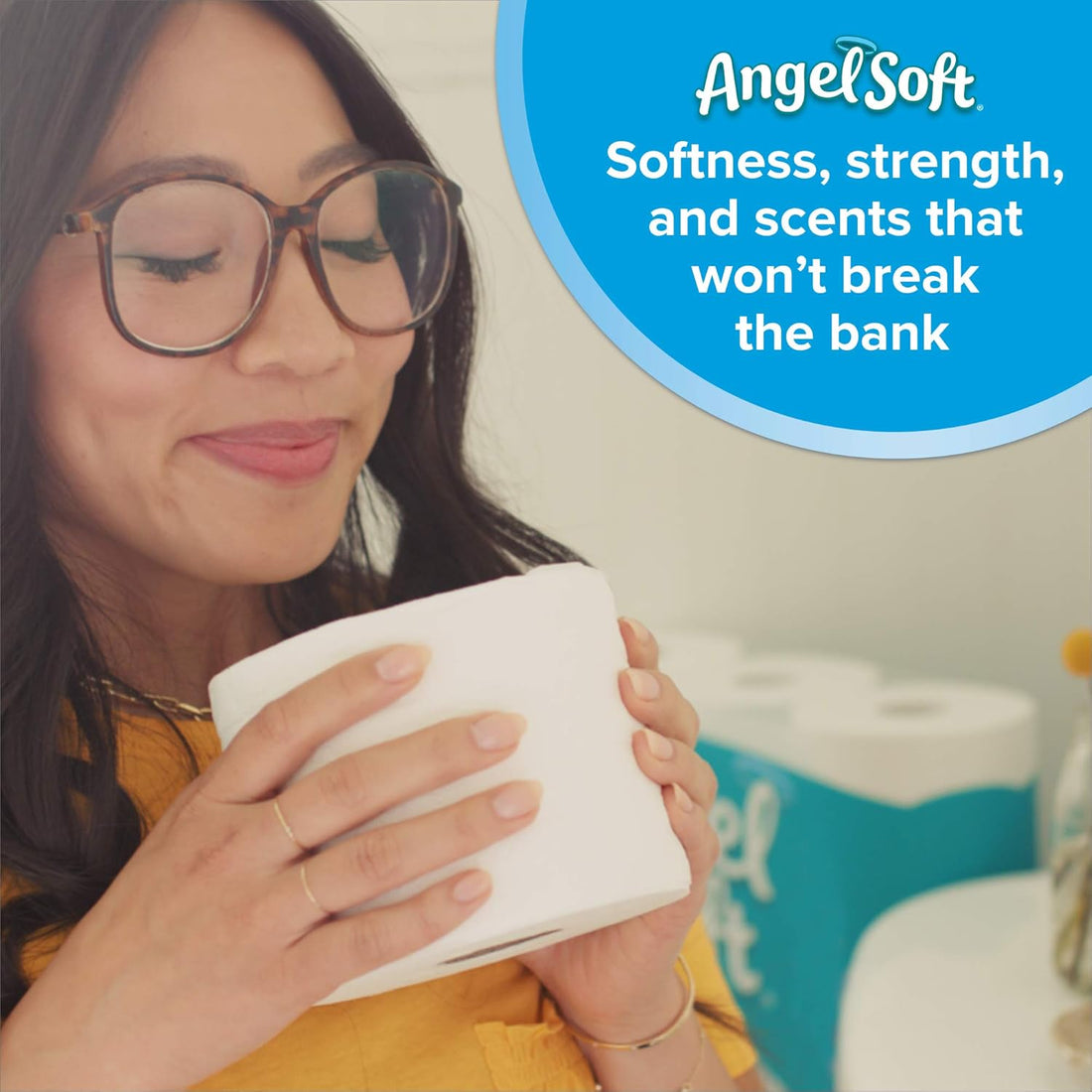 Woman holding a product with 'Angel Soft' branding and text about softness and strength.