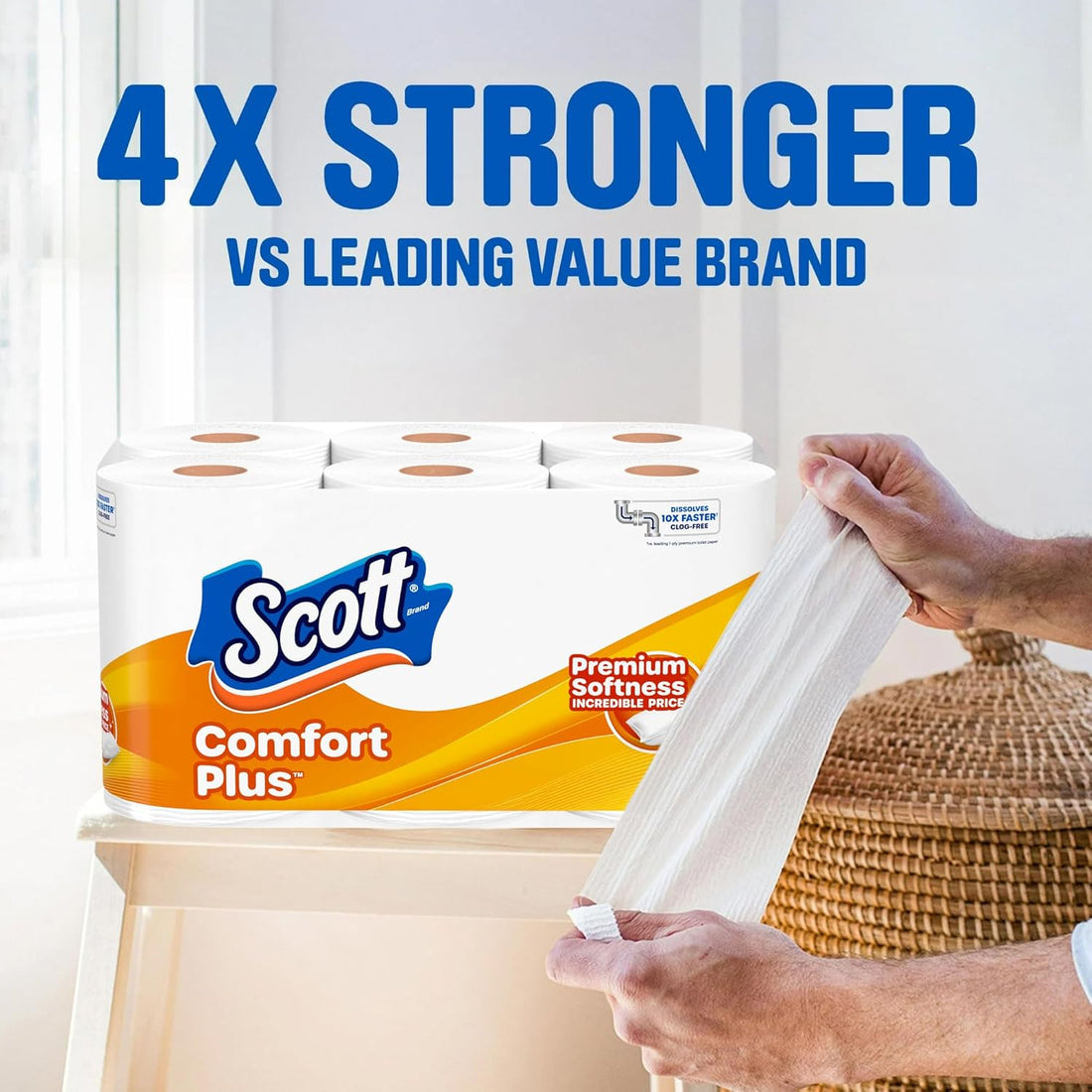 Scott Comfort Plus toilet paper with a hand pulling a sheet, against a white curtain background.
