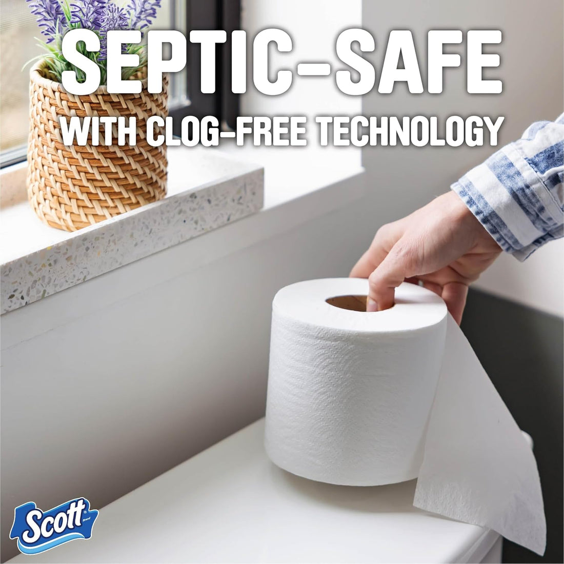 Scott toilet paper roll with a hand taking a sheet, set against a bathroom background.