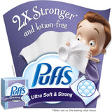 Puffs Ultra Soft & Strong tissue packaging with a cartoon character holding tissues, on a purple background.
