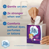 Puffs Ultra Soft tissue box with a hand pulling a tissue, featuring product benefits on a neutral background.