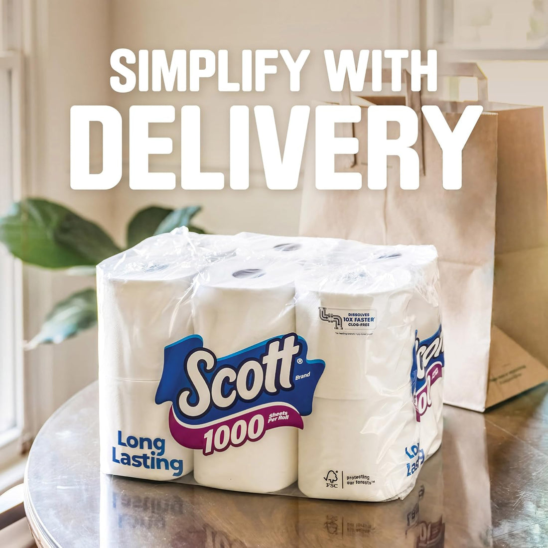 Scott toilet paper rolls on a table with a 'Simplify with Delivery' text overlay.