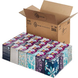 Carton of facial tissue boxes with decorative packaging on a white background