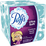 Box of Puffs Ultra Soft facial tissues with a cartoon girl on the packaging.