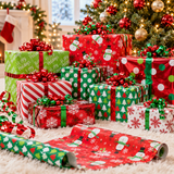 Red and green foil wrapping paper on gifts around a Christmas tree