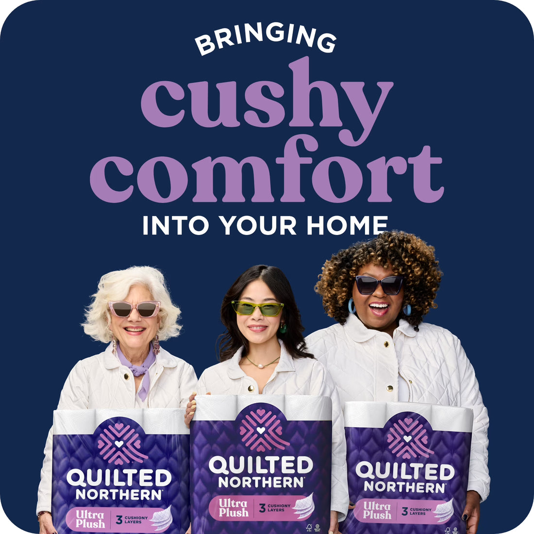 Three women holding Quilted Northern Ultra Plush packages with promotional text on a blue background